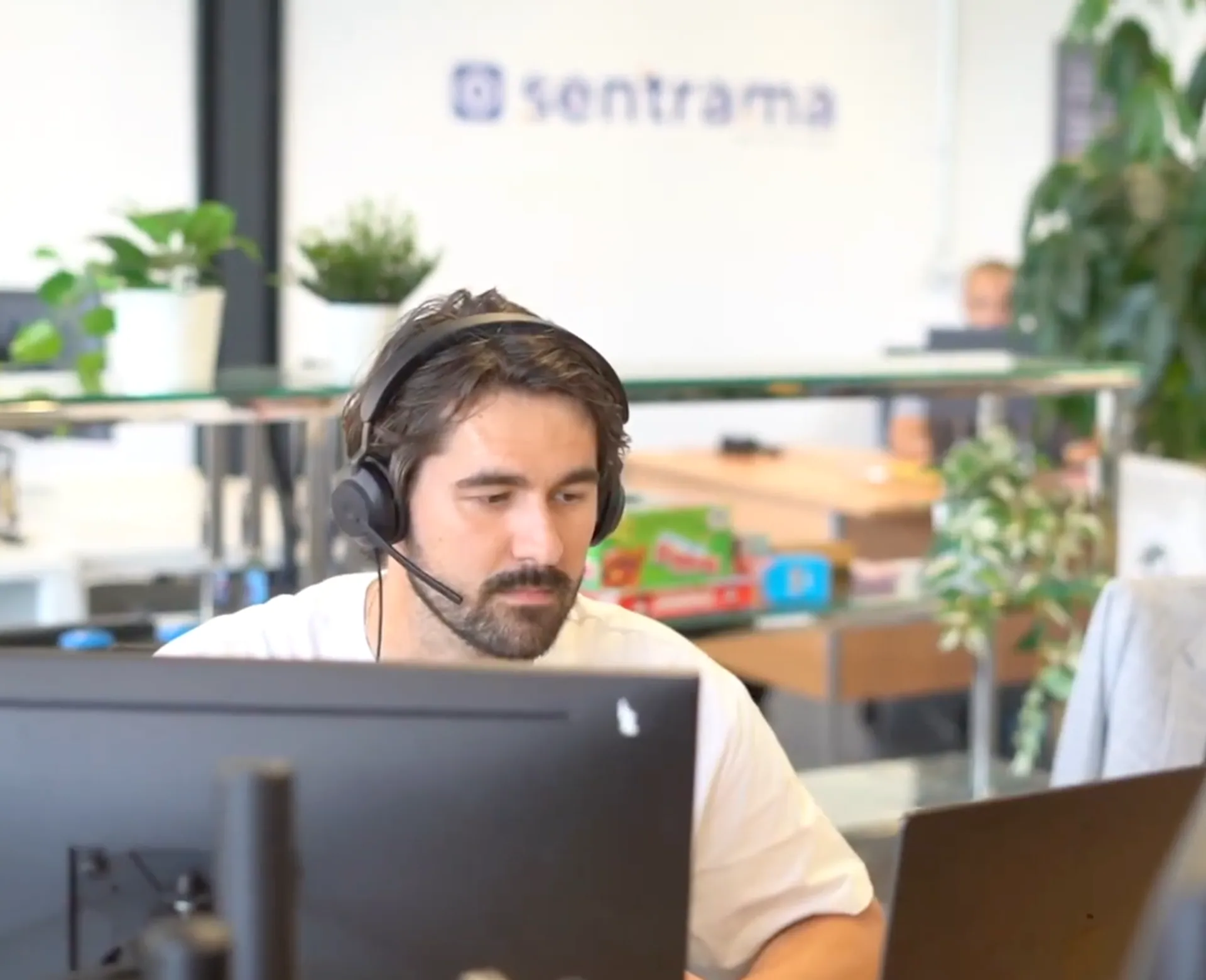 A Sentrama SDR taking a call at their desk